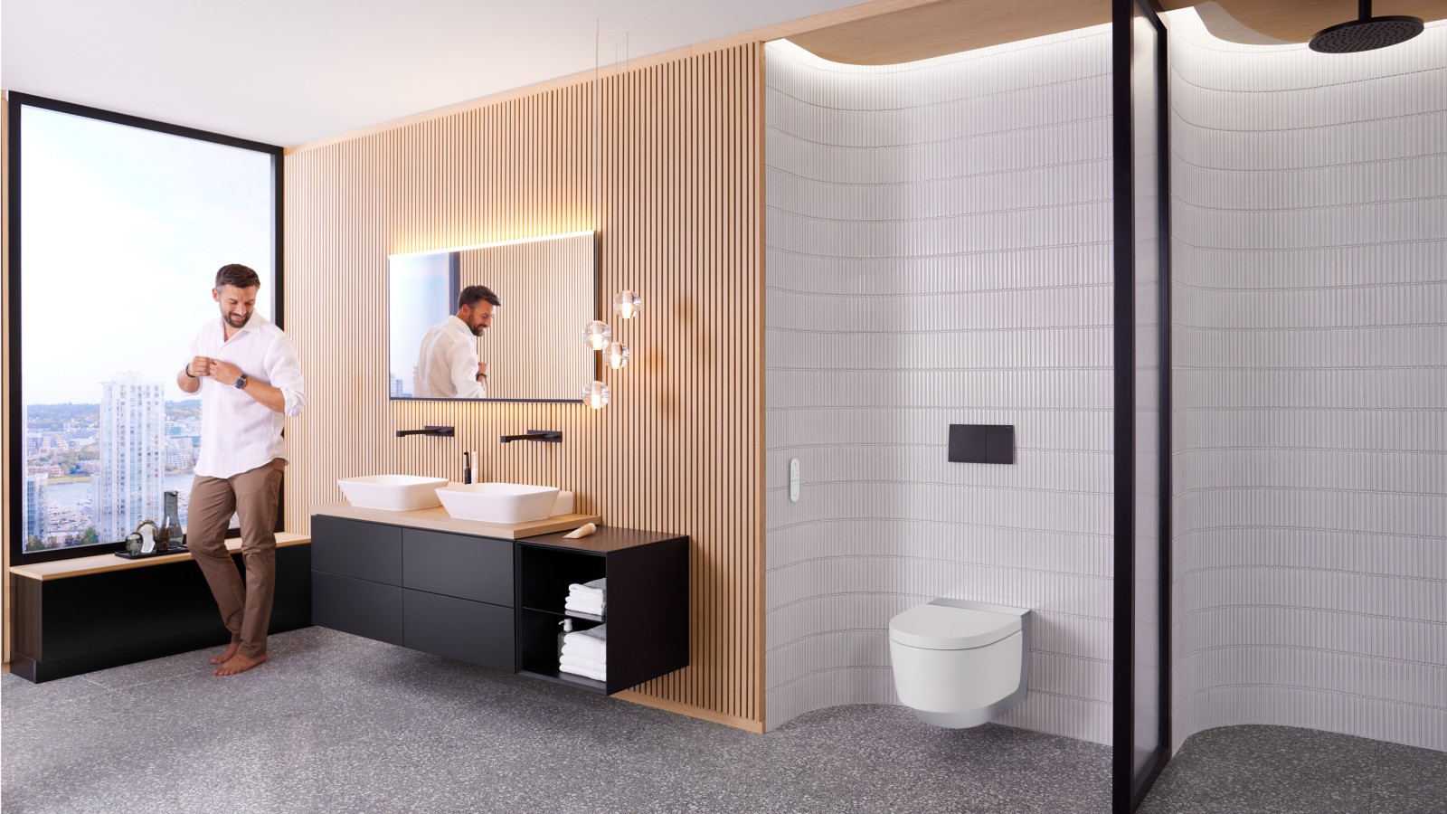 Egy férfi egy Geberit AquaClean Mera és Geberit Option Plus tükörrel berendezett Geberit ONE fürdőszobában Egy férfi egy Geberit AquaClean Mera és Geberit Option Plus tükörrel berendezett Geberit ONE fürdőszobában